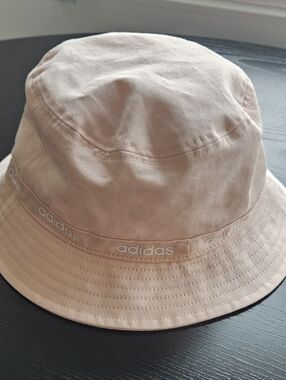 Adult Adidas Pale Peach Bucket Hat with Logo Trim.